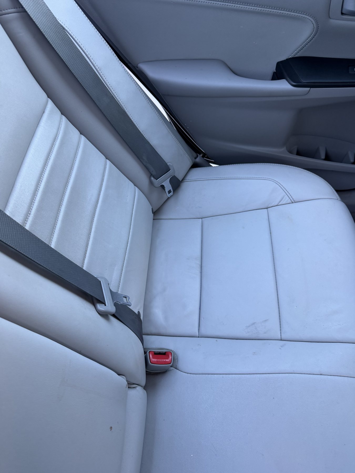 Restored white leather seat after detailing
